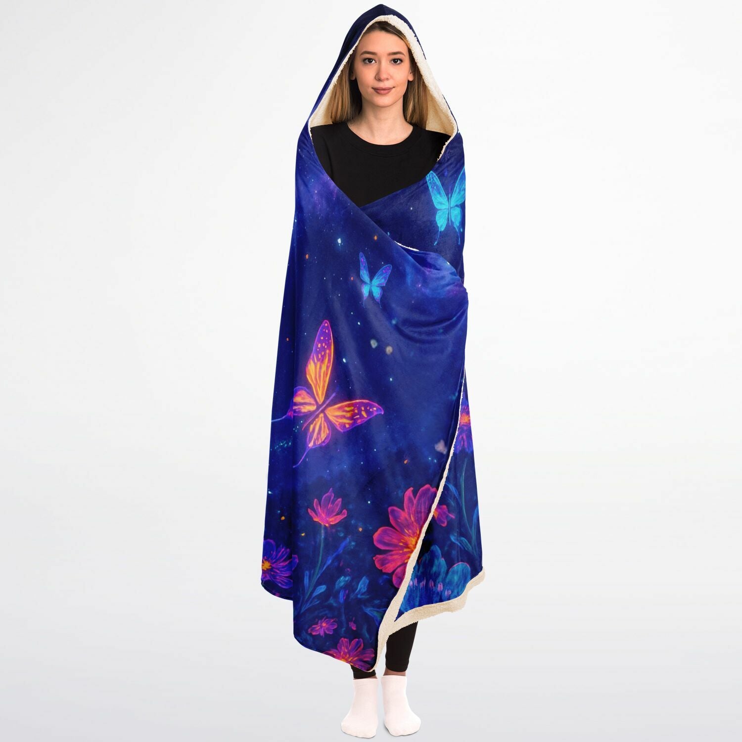 Butterfly Hooded Blanket 45x60 – soft fleece hooded blanket featuring glowing neon butterflies in vibrant blue, pink, and purple tones floating over a cosmic night-sky background full of stars and floral sparkles. Perfect for teens, butterfly lovers, cozy