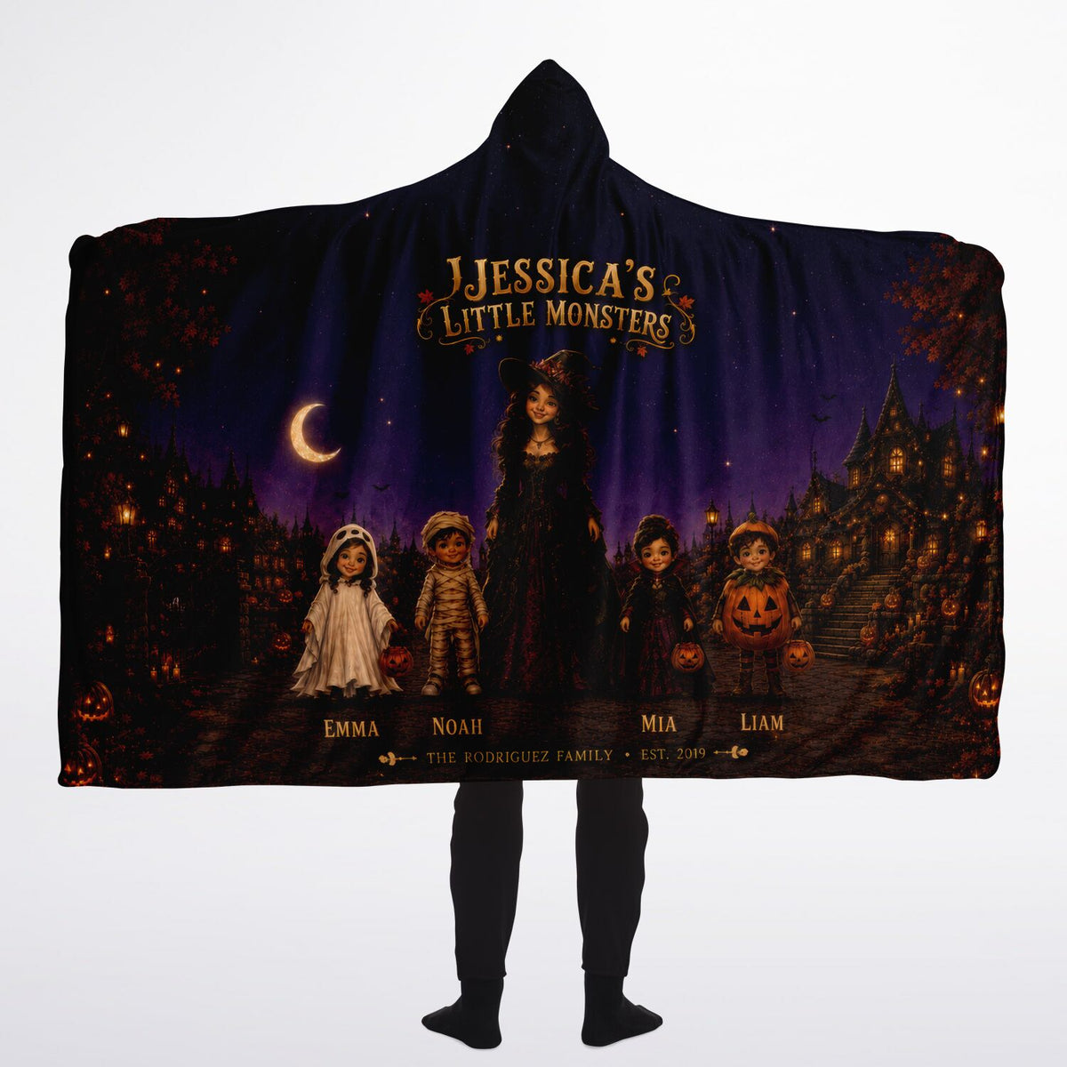 Little Monsters Halloween Hooded Blanket 60x80 – oversized cozy sherpa hooded blanket featuring a mother and her little monsters in a moonlit Halloween village