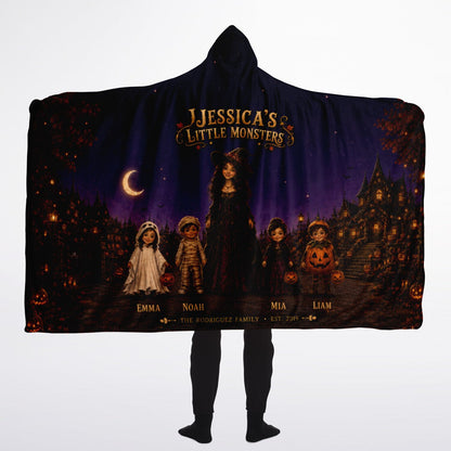 Little Monsters Halloween Hooded Blanket 60x80 – oversized cozy sherpa hooded blanket featuring a mother and her little monsters in a moonlit Halloween village